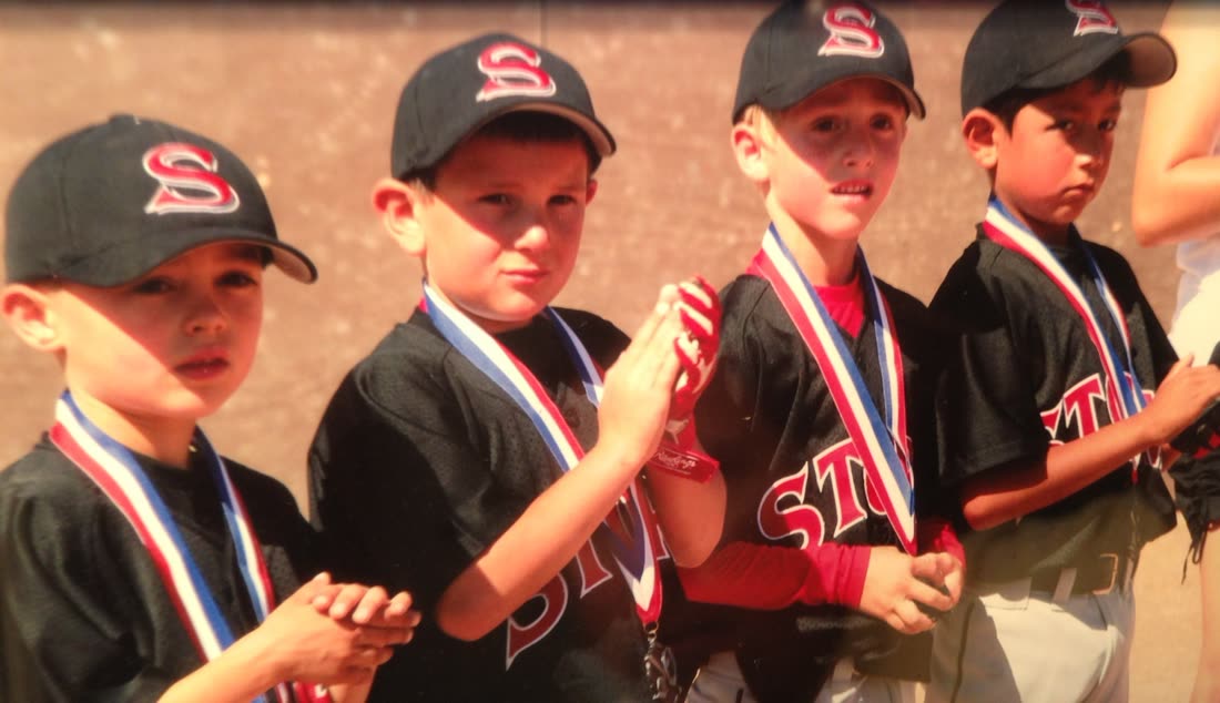 Brett's team photo with medals