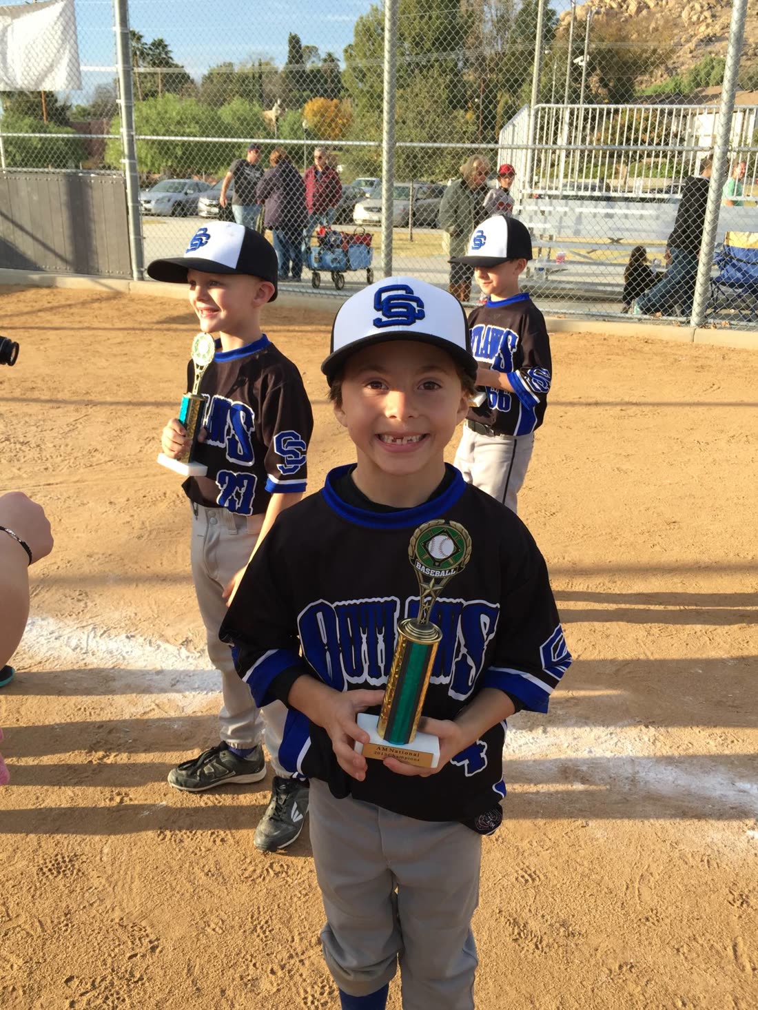Tatem holding a trophy